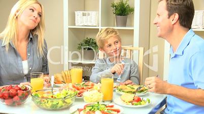 Young Caucasian Family Sharing Healthy Lunch