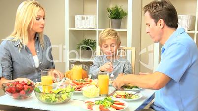 Young Family Enjoying a Healthy Meal