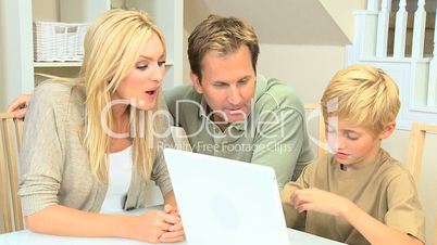 Caucasian Family With a Laptop Computer