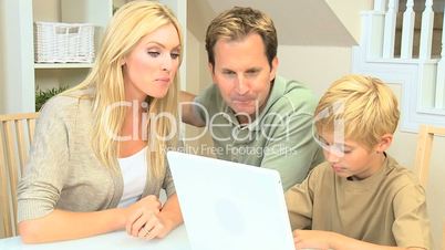 Young Family Using a Laptop Computer