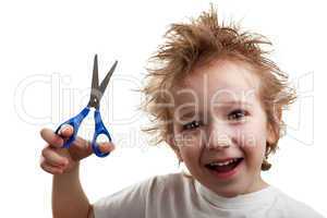 Child holding scissors