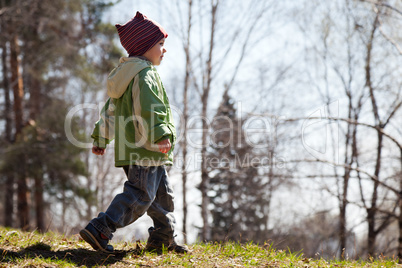 Child walking forest