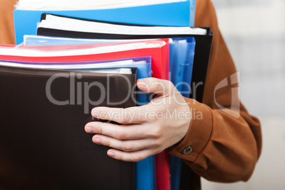 Business paper files in hand