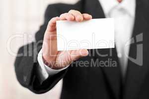 Blank card in businessmen hand