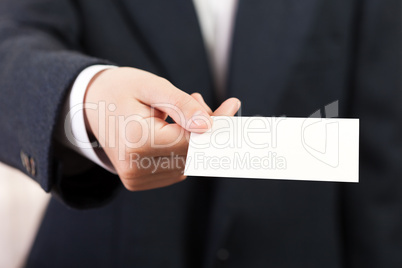 Blank card in businessmen hand