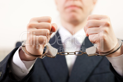 Handcuffs on hands