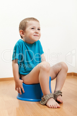 Child sitting on toilet potty