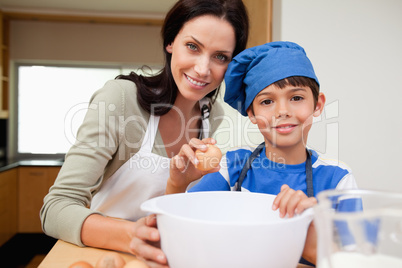 Mother and son baking cake