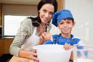 Mother and son baking cake