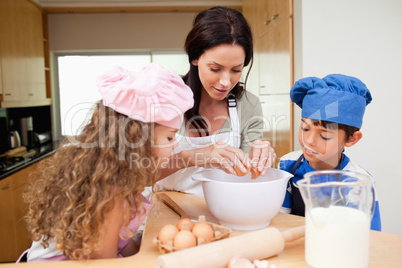 Mother making cookies with her kids