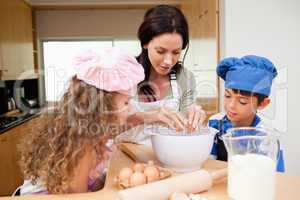 Mother making cookies with her kids