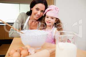 Mother and daughter preparing dough
