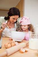 Mother and daughter preparing cookies
