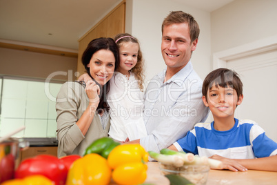 Family standing in the kitchen