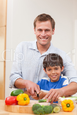 Father and son cutting vegetables