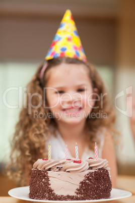 Slice of cake in front of girl