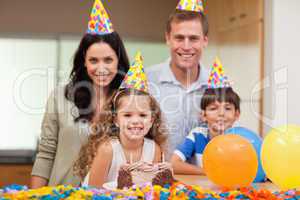 Smiling family celebrating birthday