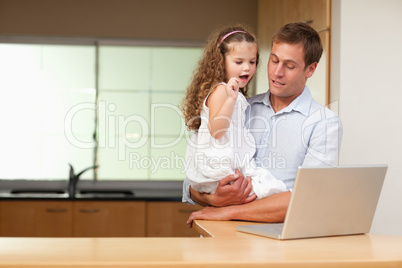 Girl is interested in her fathers laptop