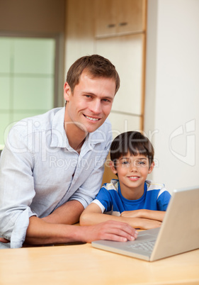 Father and son with notebook