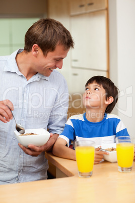 Father and son having healthy breakfast