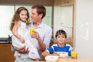 Father having breakfast with his kids