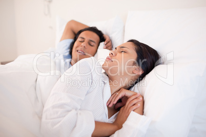Woman being woken up by snoring boyfriend