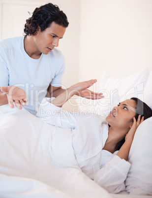 Couple arguing in the bedroom