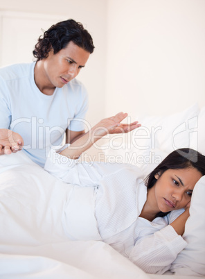 Couple having a dispute in the bed