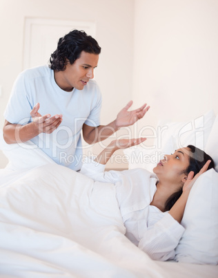 Couple fighting in the bedroom