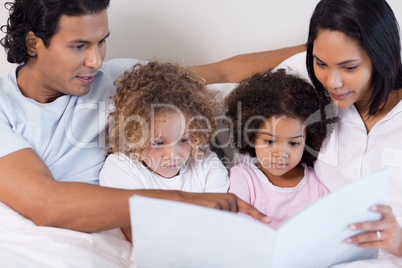 Parents reading a story for their children