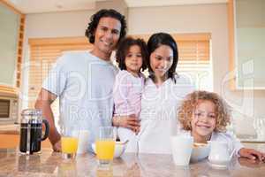 Happy family having breakfast in the kitchen together