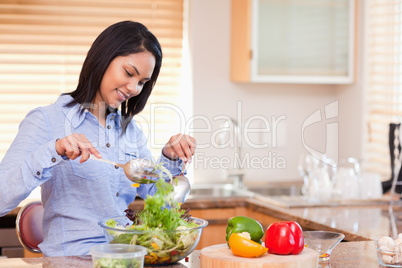 Woman stirring salad