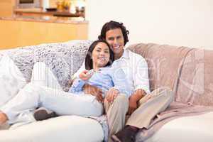 Couple enjoys watching television together