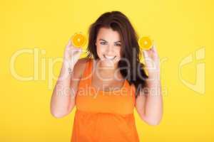 Cute Cheeky Woman Having Fun With Oranges