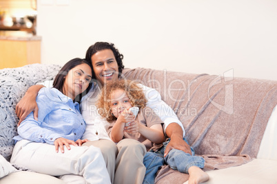 Family watching television together