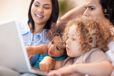 Family having a good time at the laptop together