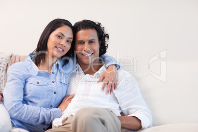 Couple on the sofa hugging