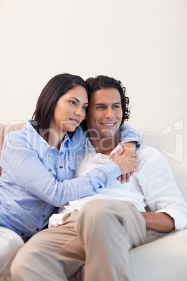 Couple on the sofa embracing