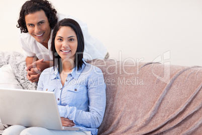 Couple on the sofa surfing the internet