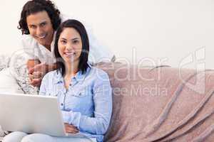 Couple on the sofa surfing the internet