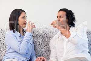 Couple drinking sparkling wine in the living room