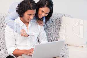 Couple booking holidays online