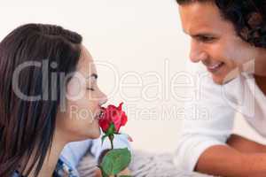Man giving his girlfriend a rose for valentines day