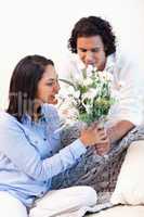 Woman getting a bouquet by her boyfriend