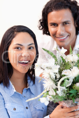 Woman holding the bouquet she got from her boyfriend