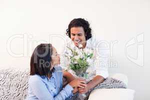 Man giving his girlfriend flowers