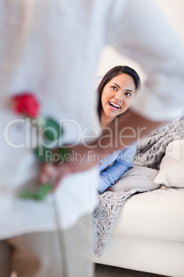 Woman about to get a flower by her boyfriend