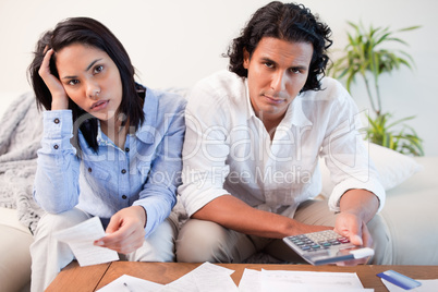 Couple calculating their costs