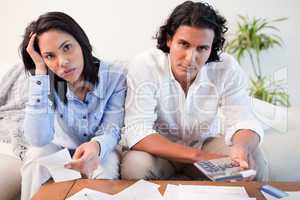 Couple calculating their costs