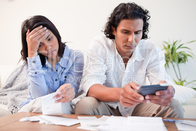 Couple checking bills